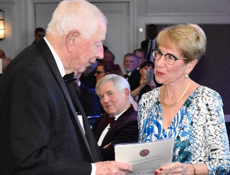 Sir Anthony Mason is presented with his Distinguished Fellowship certificate